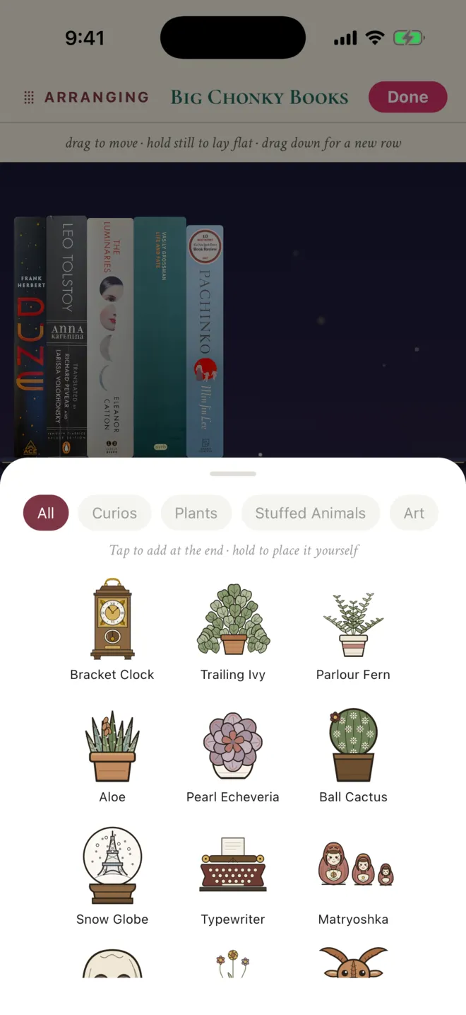 ShelfLife decor picker with a bracket clock, trailing ivy, parlour fern, aloe, pearl echeveria, ball cactus, snow globe, typewriter, and matryoshka